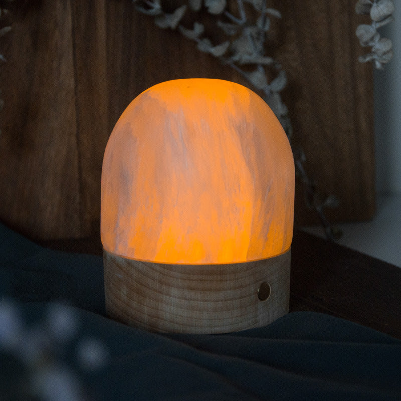 Selenite Dome Touch Night Light creating a small pool of ambient light indoors