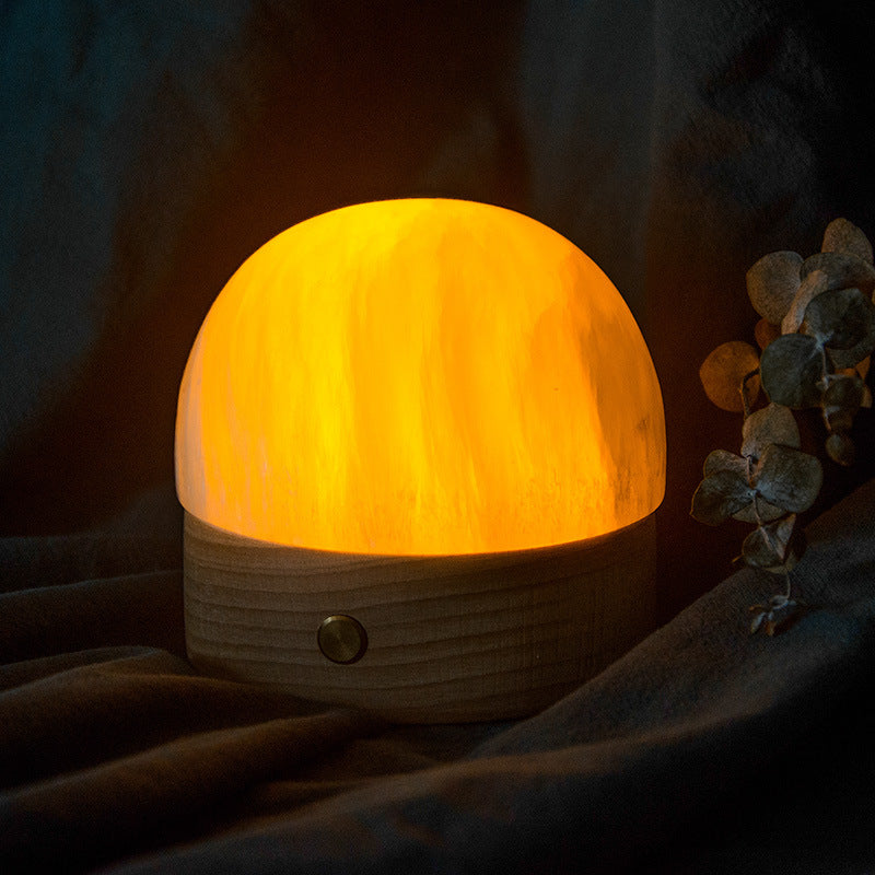 Glowing Selenite Dome Touch Night Light on a dry indoor surface