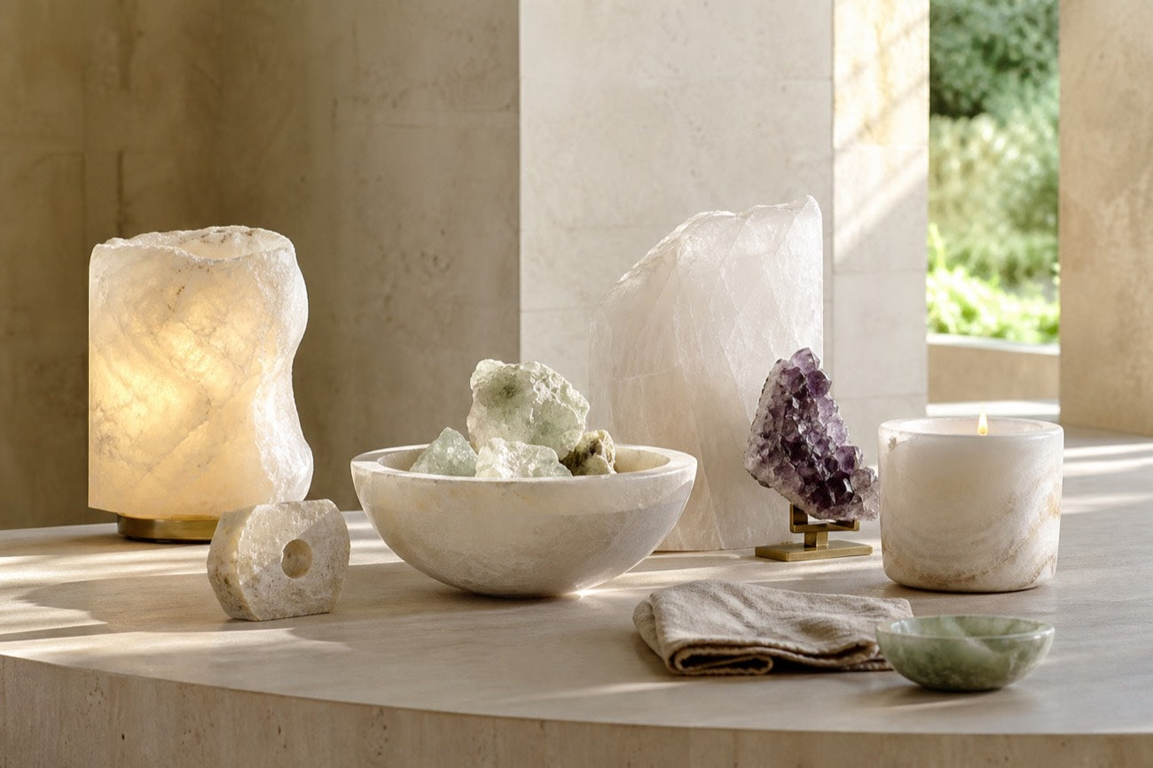 Stone bowls and ritual objects on a white surface