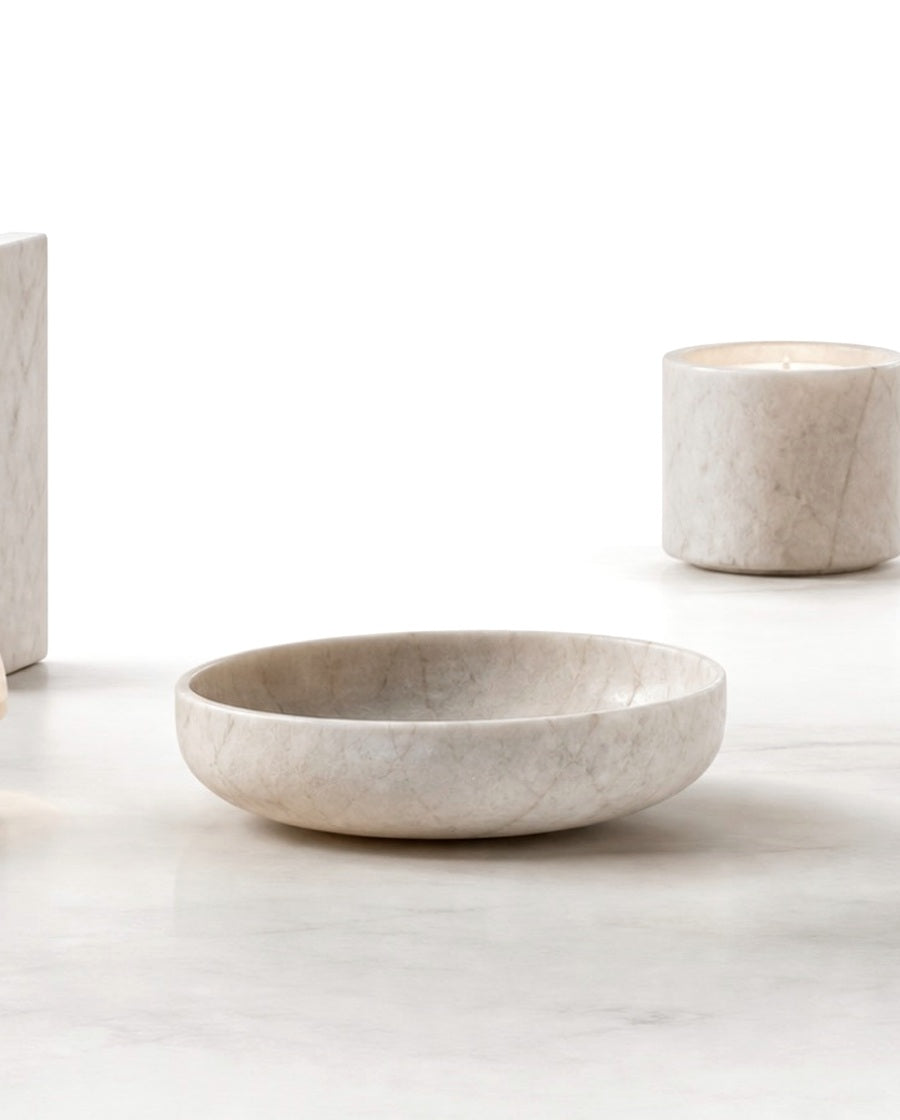 Natural stone objects on a softly lit mineral surface