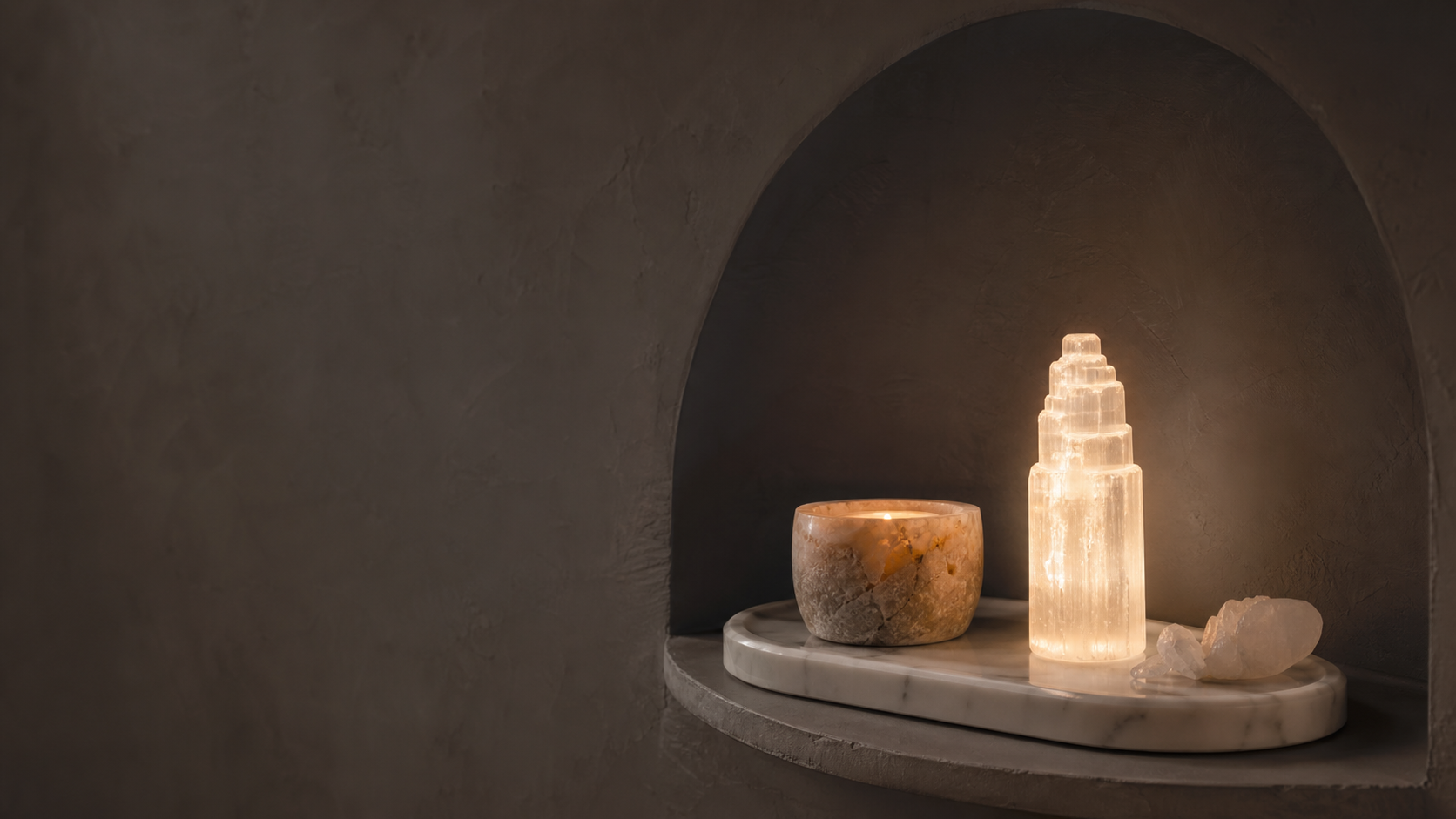 Glowing selenite lights arranged in a sculptural niche