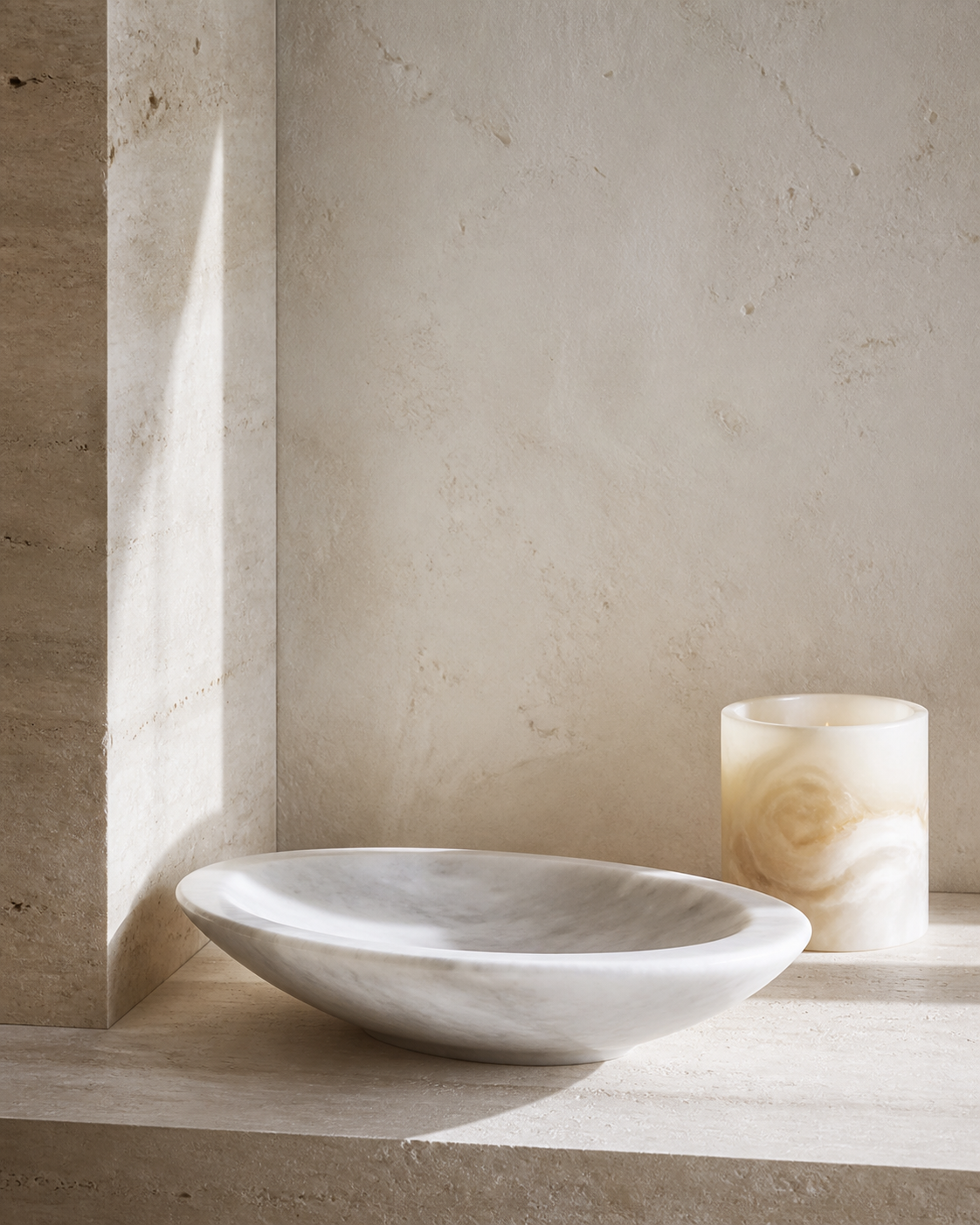 Natural stone objects on a softly lit mineral surface