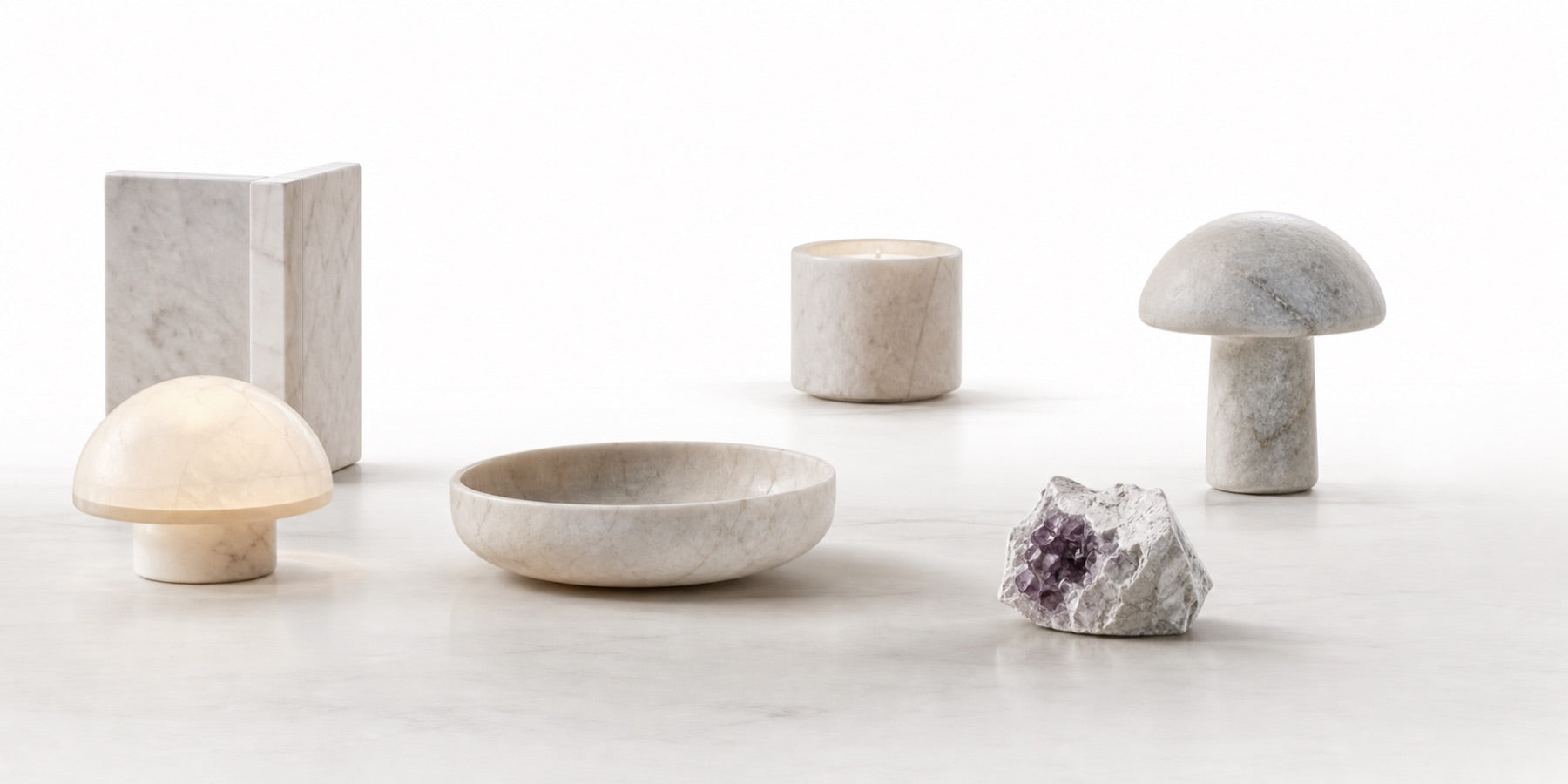 Pale stone objects floating on a clean white background
